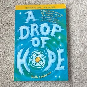 Scholastic Blue and Yellow "A Drop of Hope" Kids Book